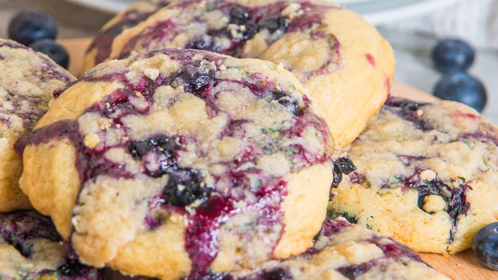 Close up image of lemon blueberry muffin cookies on a wooden board.