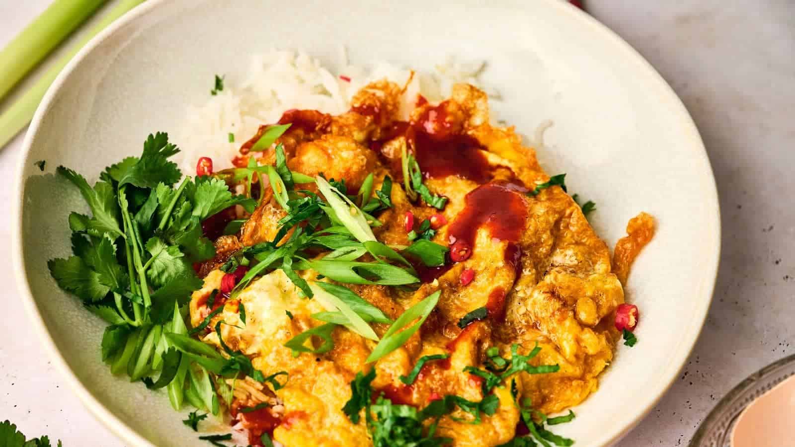 A Thai omelet with jasmine rice in a bowl.