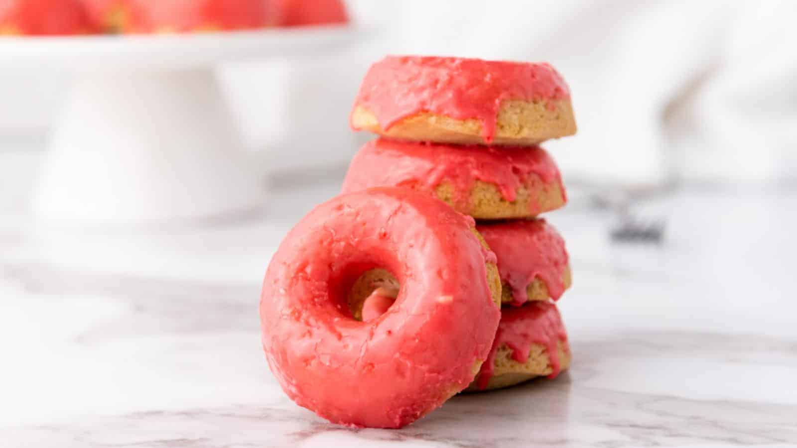 A pile of vegan baked vanilla donuts.